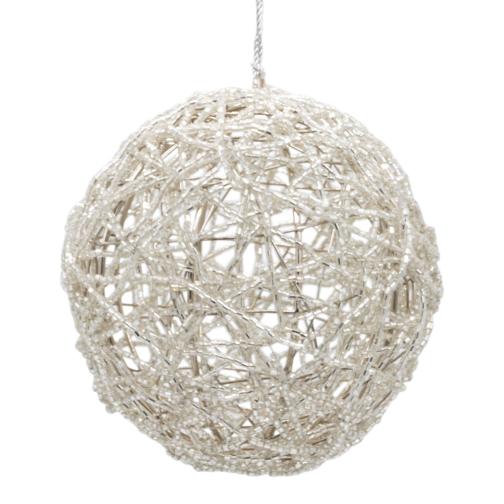 Silver beaded Christmas bauble on a white background