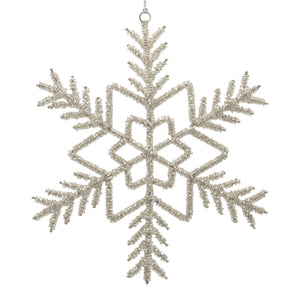 Silver beaded snowflake on a white background