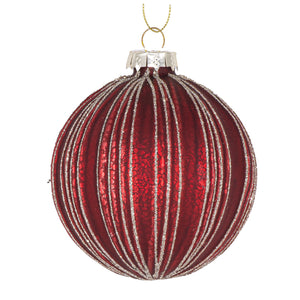Ribbed red bauble on white background